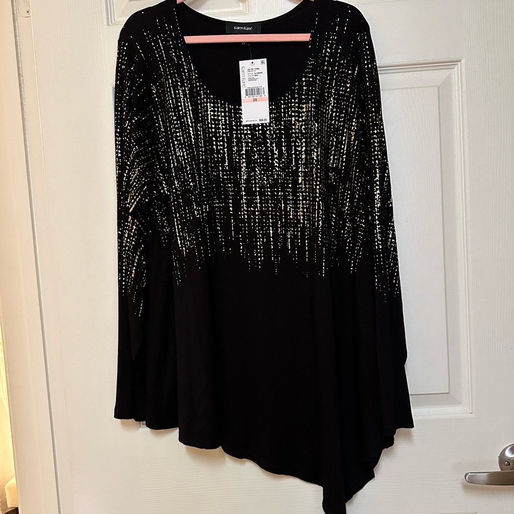 This is a beautiful Karen Kane top, size 2X with an asymmetrical hem. Never worn